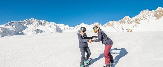 Snowboarding Lessons (from 8 y.) for All Levels from Ski School Evolution 2 Tignes