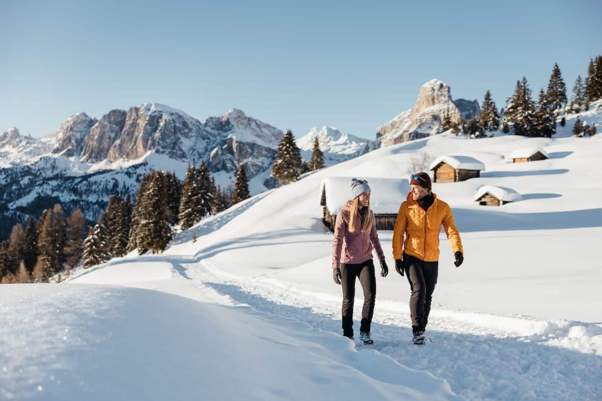 Romantic couple on winterwalk in Alta Badia