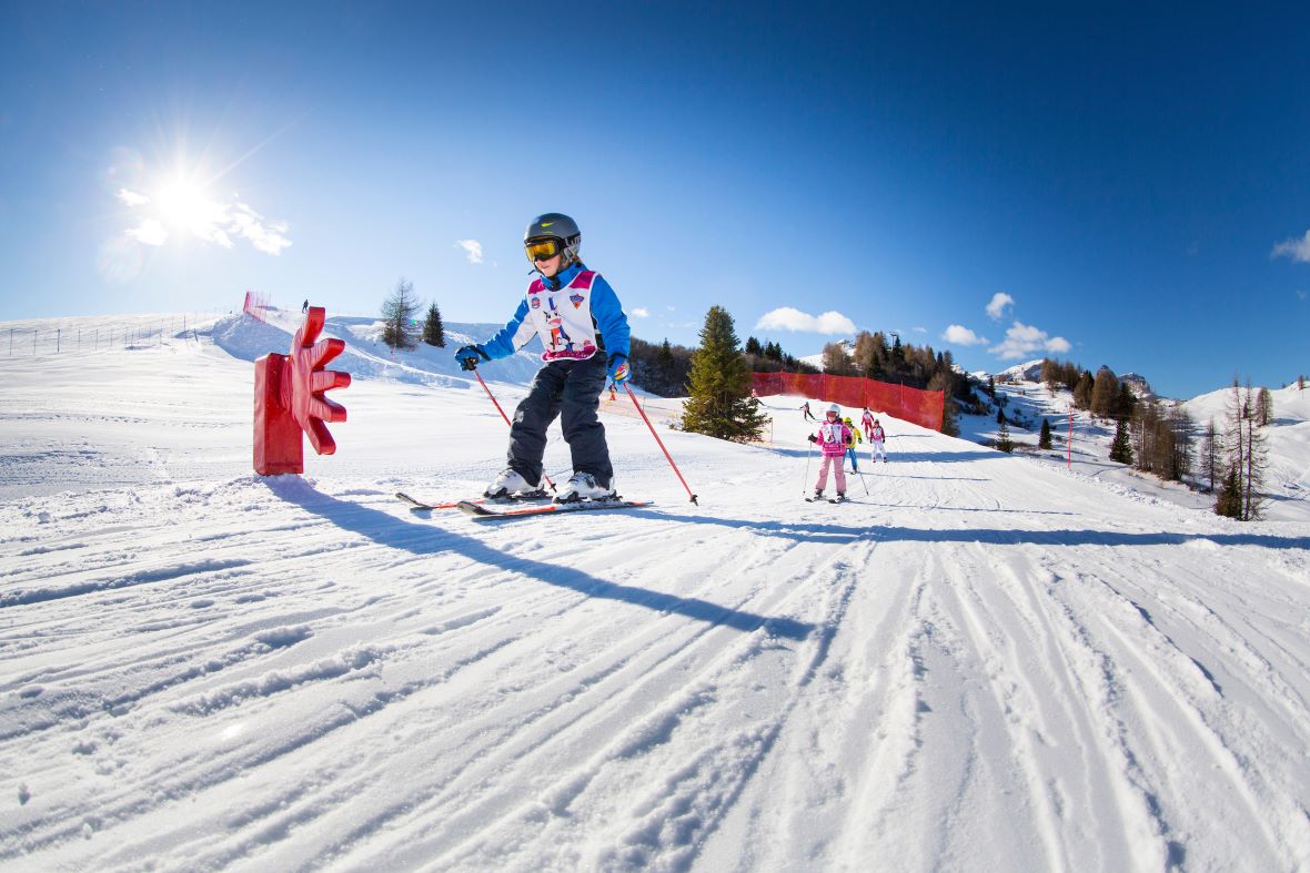 Children learning to ski in Alta Badia