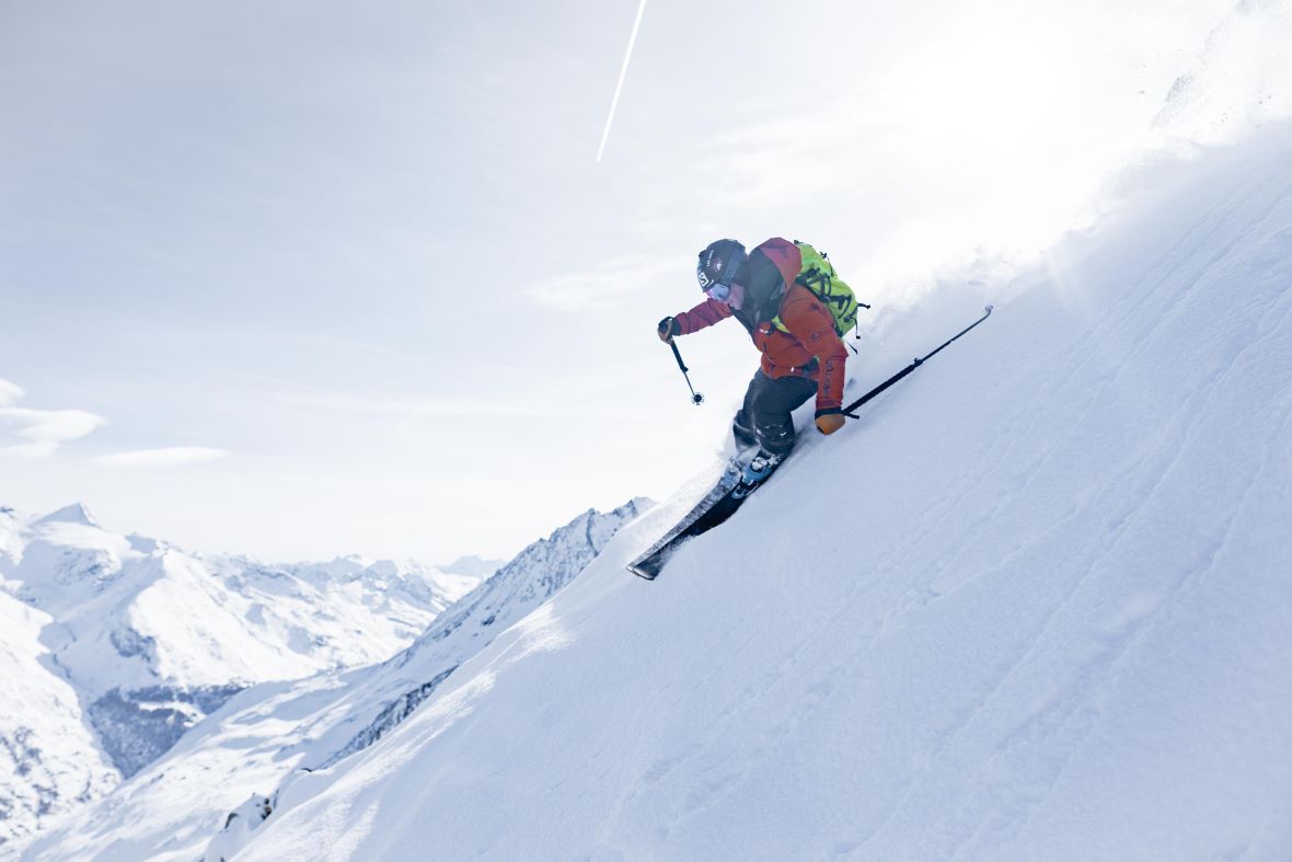 Skier on high steep ungroomed slope above Les Arcs