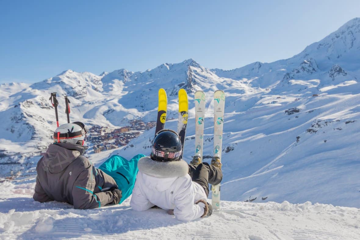 Skiers relaxing on the slopes above Val Thorens