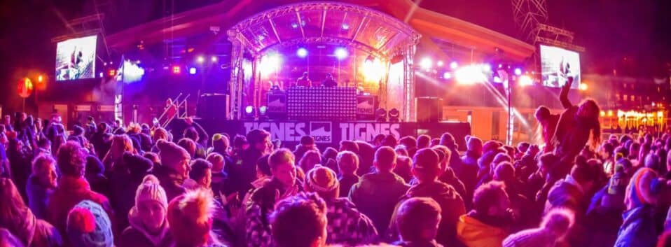 DJ playing music in the open air at night in Tignes ski resort